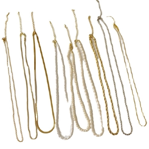 Gold and silver layered necklace set with freshwater pearls and snake chain strands