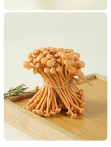 Detailed view of realistic PVC enoki mushroom bundle on a bamboo tray with rosemary deco