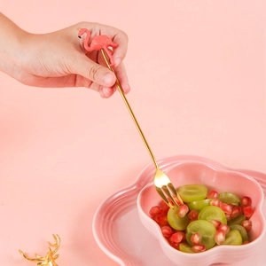 Golden stainless steel dessert fork featuring a cute pink flamingo resin character handle