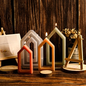 Macro detail of hollow house silicone mold and geometric aromatherapy wax candles