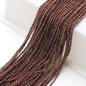 Close-up of 2mm faceted glass beads with metallic luster for DIY jewelry making