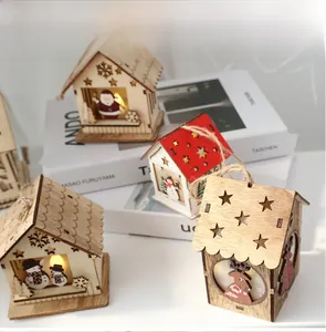 Detail of Nordic wooden Christmas house with LED lights and festive painted patterns