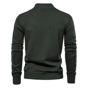 Detailed back view of dark green knit cardigan featuring ribbed cuffs and hemline