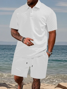 Detail of white textured jacquard fabric on men's summer polo shirt and shorts set