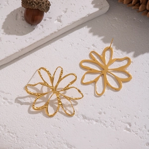 Elegant 18K gold-plated stainless steel hollow flower stud earrings on white surface