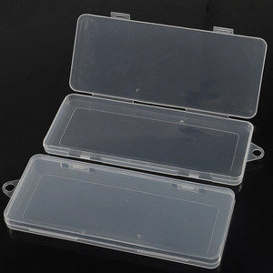 Three transparent plastic storage boxes with lids and hanging holes on a dark background