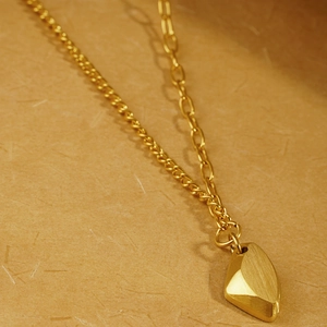 Minimalist matte gold titanium steel necklace featuring a geometric brushed pendant