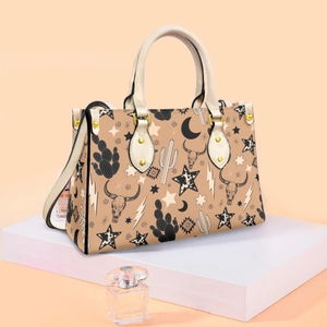 Detail of PU leather handbag with western patterns on a white geometric display stand