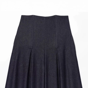 High-waist pleated indigo denim skirt for women featuring a minimalist retro A-line design