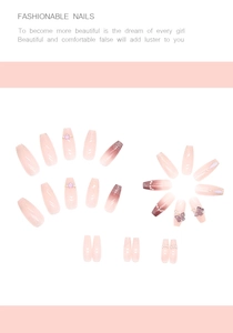Detail showing long ballerina press-on nails with pink gradient and 3D butterfly charms