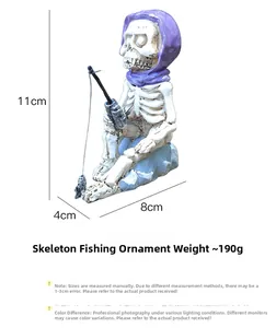 Detail showing dimensions of the skeleton fishing resin ornament at 11cm height