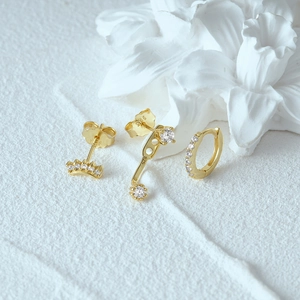 Close-up of gold-plated 925 sterling silver earring set with sparkling zircon stones