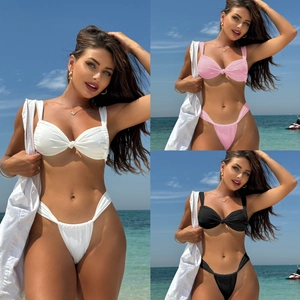 Three-color split bikini set featuring knotted tops and side-tie high-cut bottoms at the beach