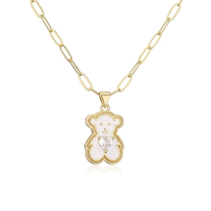 Detailed view of 18K gold plated bear pendant with white enamel and heart zircon stone