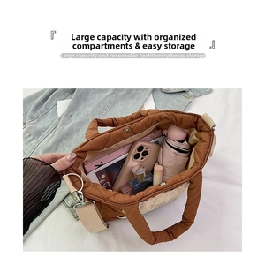 Interior view of brown quilted tote bag showing large capacity for essentials