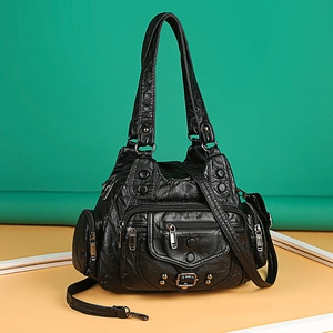 Retro black multi-pocket handbag with washed leather texture and silver metal rivets