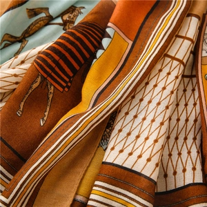 Macro detail of high-quality cotton linen scarf featuring equestrian horse patterns