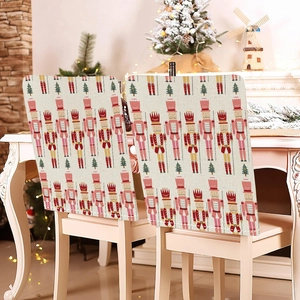 Detailed Christmas chair covers featuring Nutcracker and Xmas tree patterns on dining chairs