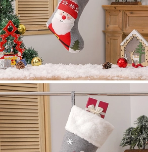Detail of red and grey Christmas stocking with 3D Santa and snowflake embroidery décor