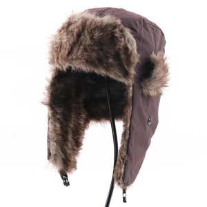 Detailed view of the dark brown winter trapper hat with windproof fabric and thick faux fur