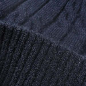 Navy blue cable knit beanie with warm fleece lining and thick ribbed texture design