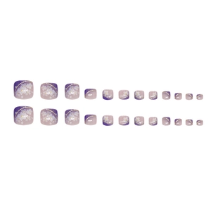Lavender gradient press-on toenails with white flower designs and gold glitter details