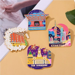 Detailed view of four Shanghai landmark enamel pins featuring Oriental Pearl and Bund