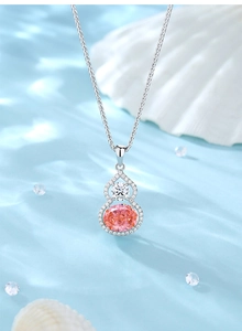 Macro shot of S925 silver gourd pendant with pink oval stone and white cubic zirconia