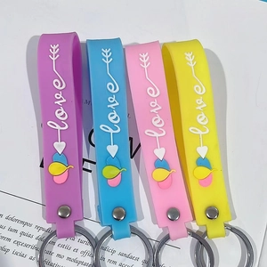 Detail of four colorful silicone love keychains with stainless steel rings in a set