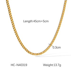 Detail view of gold box chain necklace with 45cm length and 0.3cm width measurements
