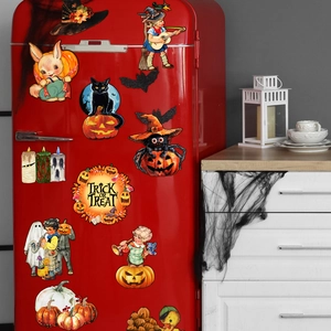 Vintage Halloween magnets with witch and ghost designs on a red refrigerator