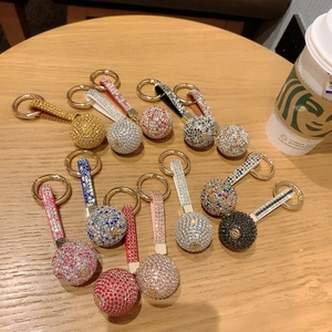 Detail of sparkling crystal ball keychains with rhinestone PU leather strap and gold ring