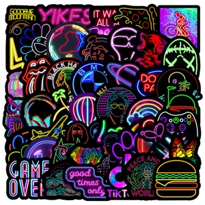 Close-up of waterproof neon graffiti stickers with high saturation glow effects for laptops