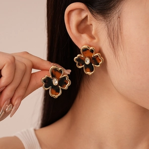 Vintage leopard resin clover earrings with gold metal trim and central crystal inlay