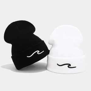 Winter rib-knit beanie with wavy embroidery detail, available in black and white colors