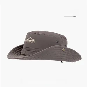 Detail of gray cotton sun hat with outdoor mountain embroidery and metal eyelets