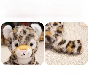 Close-up of realistic leopard plush toy with soft spotted faux fur and pink nose