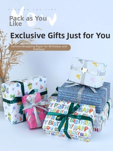 Detail of colorful cartoon birthday wrapping paper with unicorn and rainbow designs