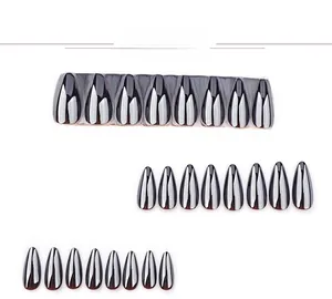 Detail view of almond shaped black metallic press-on nails in 24 pieces set