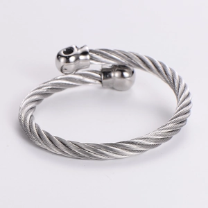 Silver stainless steel cable wire cuff bracelet with spherical skull head ends for men