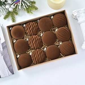 Detailed view of 12 pack brown velvet Christmas balls in a rustic gift box arrangement