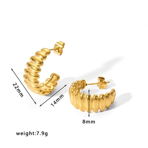 Detailed view of ribbed gold C-shaped earrings with 22mm size and 7.9g weight specs