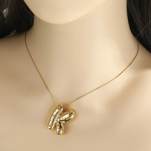 18k gold plated chunky letter K pendant necklace with cubic zirconia inlay on model