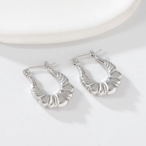Minimalist silver U-shaped earrings with unique radial pleated texture and metallic finish