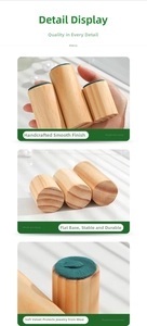 Macro shot of three-piece solid wood ring displays with smooth velvet top and natural grain
