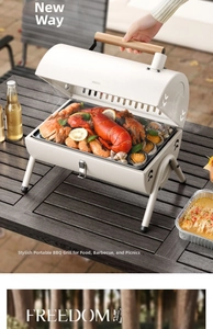 Detail view of a portable charcoal BBQ grill with seafood on a wooden table setup