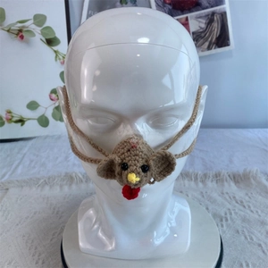 Close-up of handmade crochet rooster nose warmer with creative animal knit design
