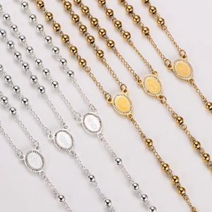 Polished rosary necklaces with sparkling rhinestone cross pendants in gold and silver finish