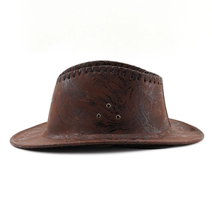 Close-up of brown western cowboy hat with marble texture and metal ventilation holes