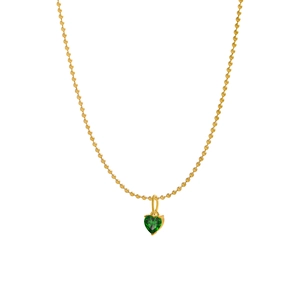 Detail of green heart-cut gemstone pendant on golden bead chain with white background